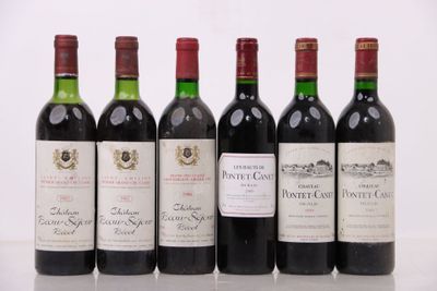six bouteilles de vin sont alignées sur une table