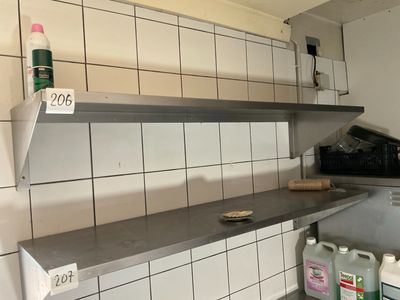 a shelf that has a lot of cleaning products on it