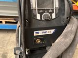 a welding machine that is sitting in a warehouse