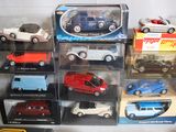 a lot of toy cars on display in a display case