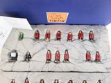 a lot of miniature figurines that are in a box