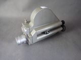 a silver camera that is on a gray surface