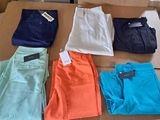 several pairs of pants are laid out on a cardboard box