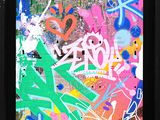 framed picture of colorful graffiti on a wall in a black frame