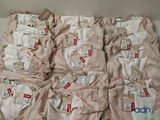 a lot of baby clothes that are on a table
