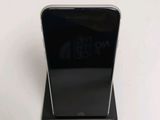 a close up of a cell phone that is on a stand