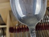 a silver spoon that is sitting on a table