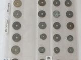 a lot of coins in a plastic bag on a table