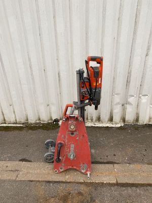 a small machine that is sitting on the side of the road