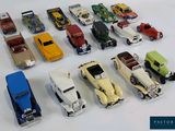 a lot of toy cars that are sitting on a table