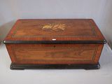 an image of a wooden box sitting on top of a white table