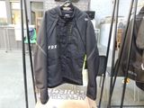 a black jacket hanging on a rack in a store