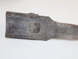 an old knife with a wooden handle on a white surface