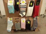 several pairs of men ' s socks are on display on a carton
