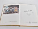 an open book with a picture of a group of people on it