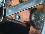 steering wheel of an old car with gauges and gauges
