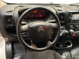 the interior of a car with a steering wheel and dashboard controls