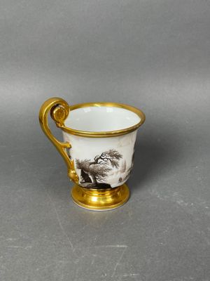 an image of a cup with a picture of a man and a dog on it
