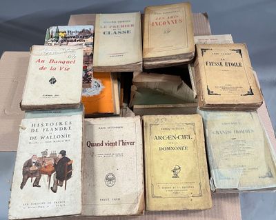 a lot of books that are sitting on top of a table