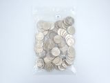 a bag full of silver coins on a white surface