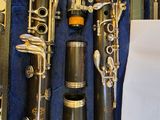 two clarinets in a case with a sheet of paper
