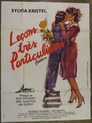 an old movie poster of a man kissing a woman on top of a pile of books