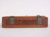 an old wooden box with a metal latch on top of it