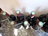 several bottles of wine are lined up on a table