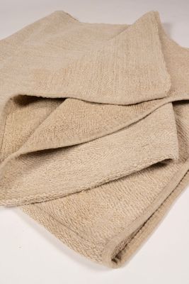 a close up of a pile of towels on a white surface