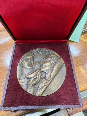 an image of a medal in a box on a table