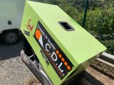 a box that is sitting on the side of the road