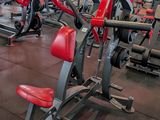 a large gym with a lot of machines in it