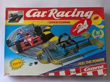 a box with a toy racing car on it