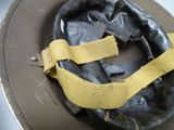 a hat that has a yellow ribbon on it