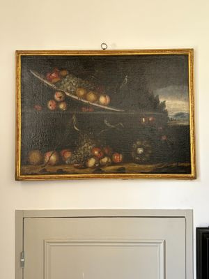 a painting on the wall above a door in a room