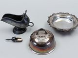 a small silver plate and a small silver bowl and a small silver bowl