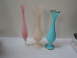 three vases that are sitting on a table