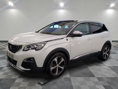 a white car is parked in a room with a checkered floor