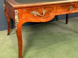 an antique desk with a marble top and drawers on it