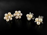 a pair of pearl and diamond earrings and a ring