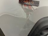 a sticker on the hood of a white car