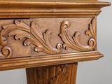 a close up of a wooden table with carvings on it
