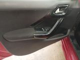 the door handle of a red car with the door handle open