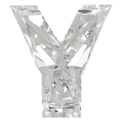 un gros plan d'une lettre « v » taillée en diamant sur fond blanc