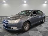 a picture of a car that is parked in a showroom