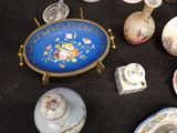 many different types of vases and bowls on the table