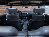 a view of the inside of a car from the driver ' s seat