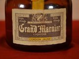 a bottle of liquor with a label on it sitting on a table