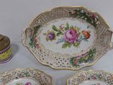 three plates and a bowl sitting on a table
