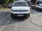 a white van that is parked in a parking lot